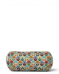 Model lying on a beach towel with the DE LA MUR Flora floral terry accessory
