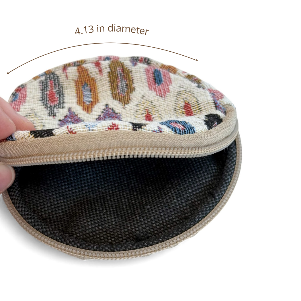 Open DE LA MUR geometric coin purse showing lined interior, 4.13 in diameter