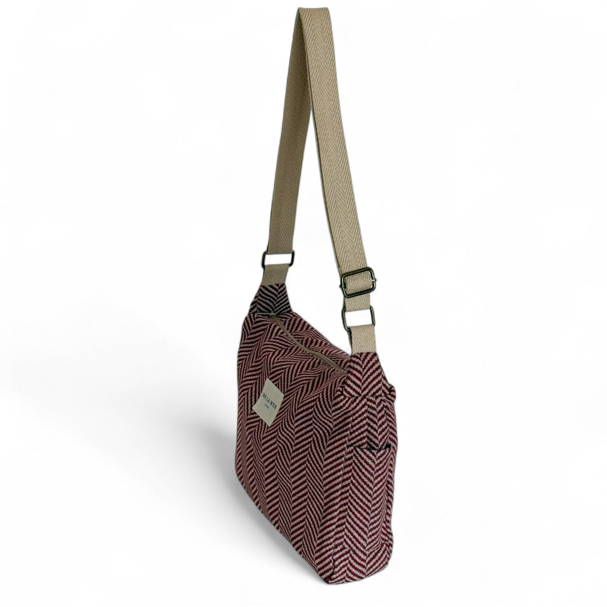 DE LA MUR Dubai herringbone handbag three-quarter view with adjustable crossbody strap