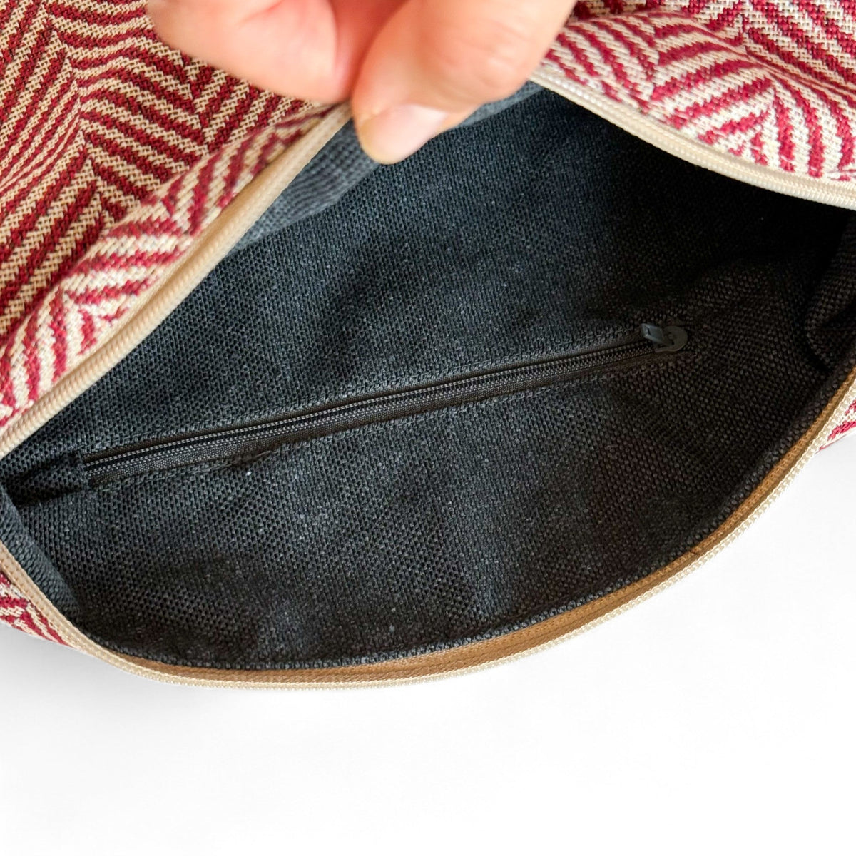 Open DE LA MUR Dubai handbag showing the lined interior and zipped inner pocket