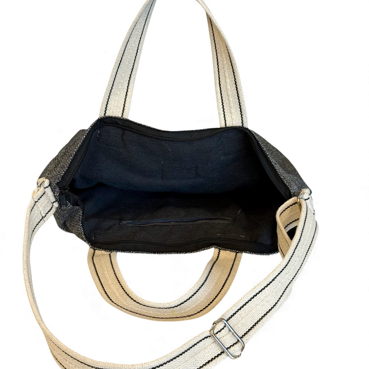 Open DE LA MUR Sinay handbag showing the black lined interior with zip pocket