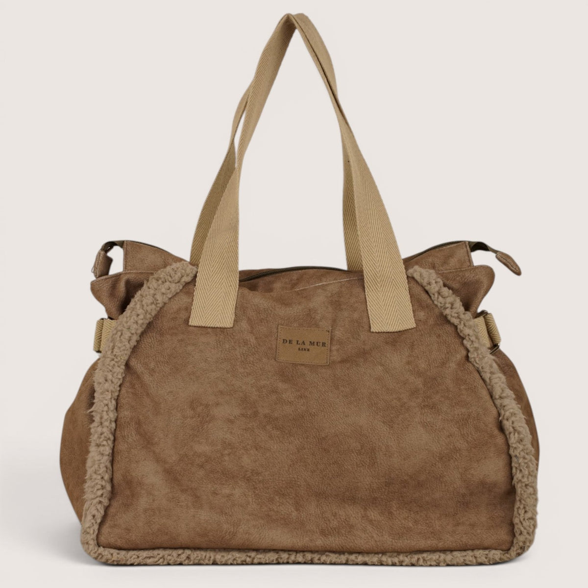 DE LA MUR Noce faux suede large shoulder bag in taupe, front view on plain background