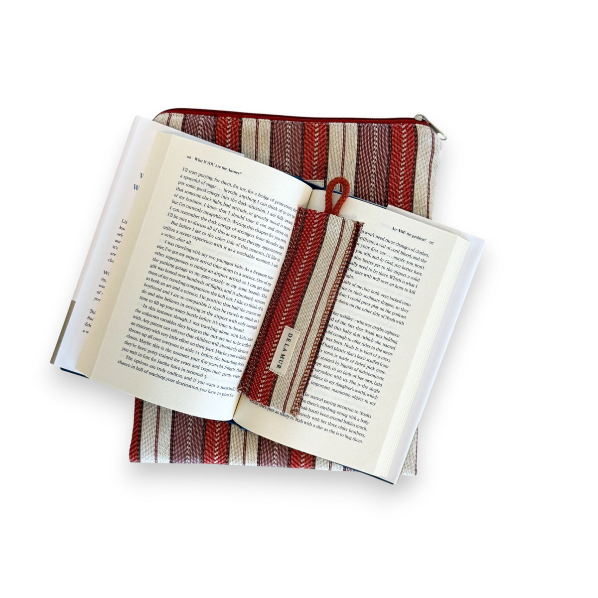Open book on the DE LA MUR Make striped cover with the matching woven bookmark in place