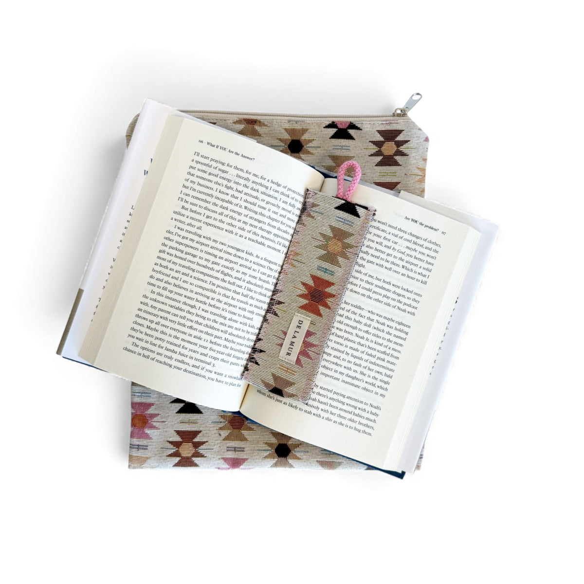 Open book on the DE LA MUR Royal geometric cover with the matching woven bookmark in place