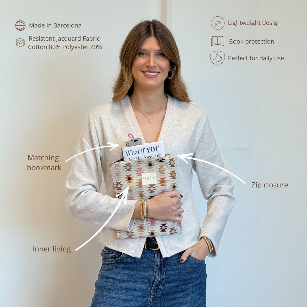 Model holding the DE LA MUR Royal geometric book cover with callouts for bookmark and zip