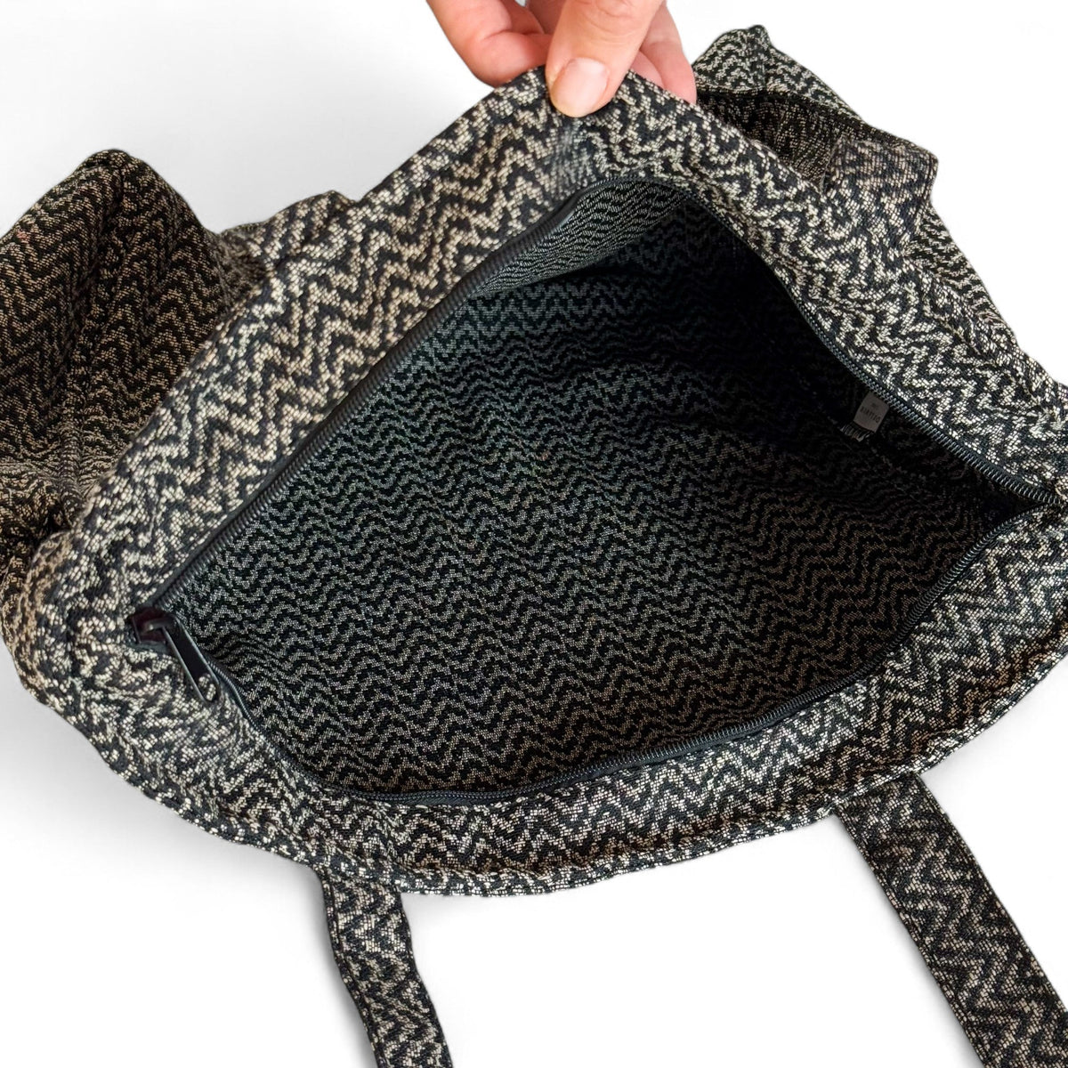 Open DE LA MUR Dana tote bag showing the zippered lined interior