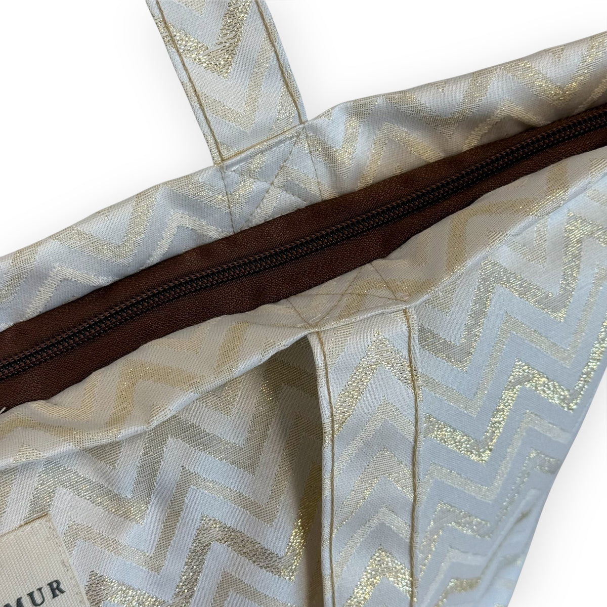 Open DE LA MUR Astro tote showing the zip closure and interior