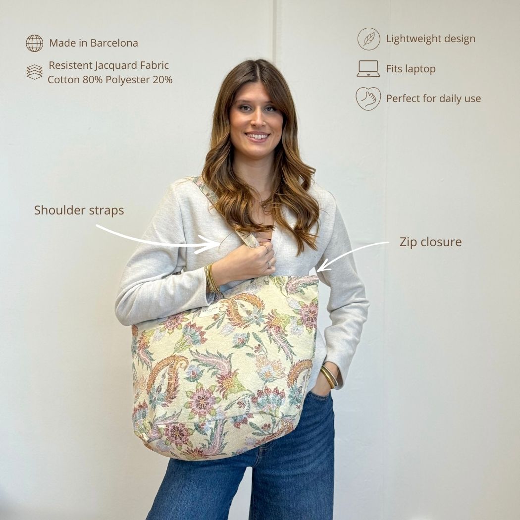 Model wearing the DE LA MUR Color paisley tote, features infographic