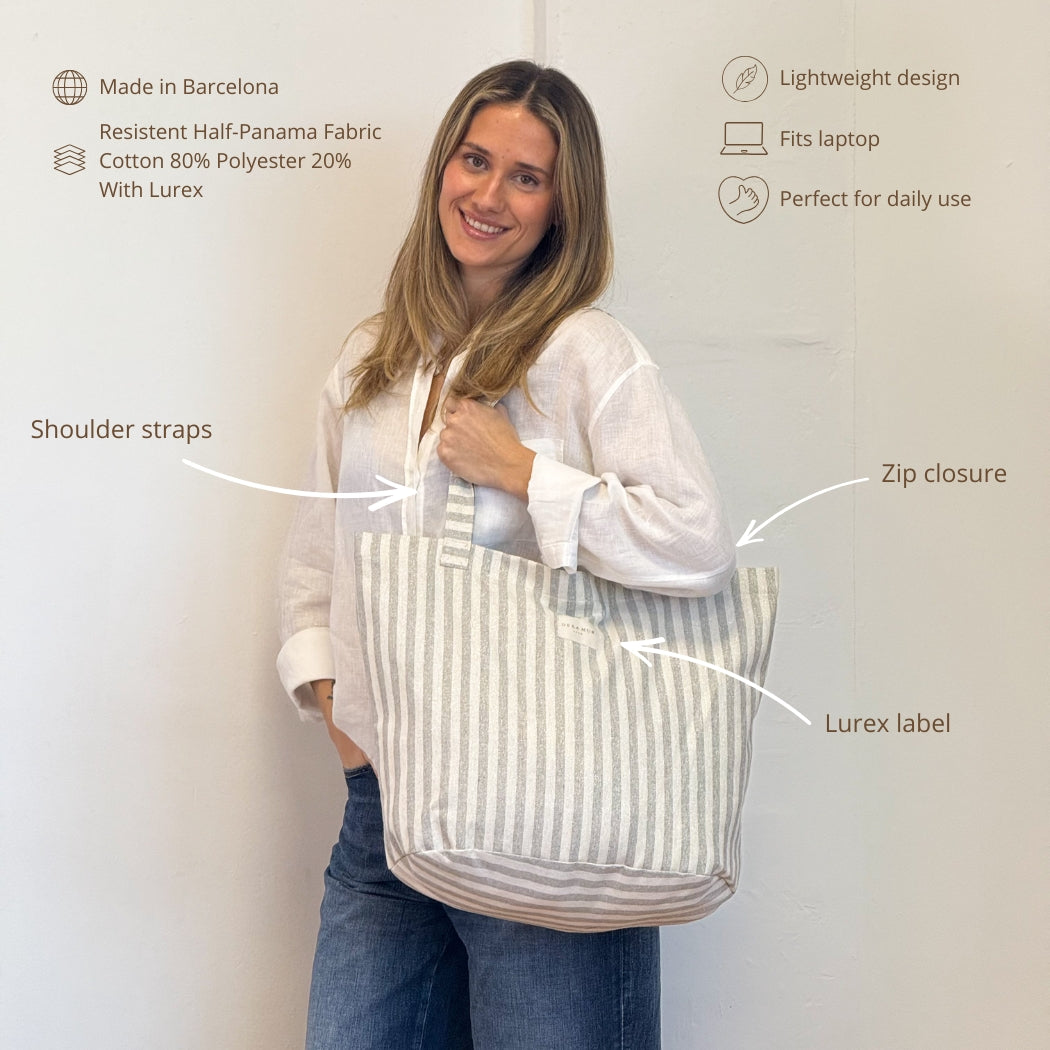 Model carrying the DE LA MUR gray striped tote bag, features infographic