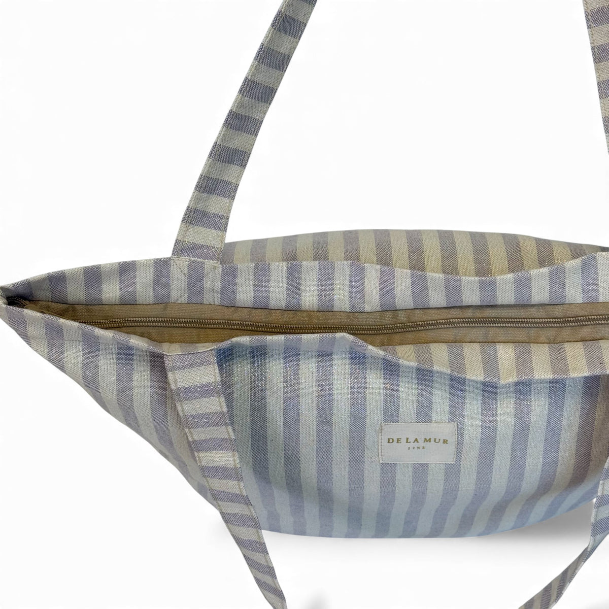 Open DE LA MUR lilac striped tote showing the zip closure and interior