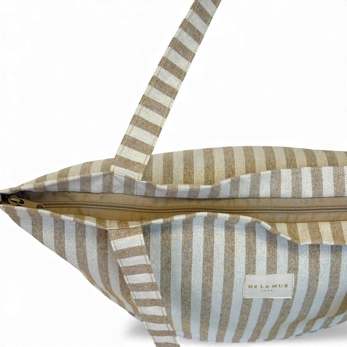 Open DE LA MUR mustard striped tote showing the zip closure and interior