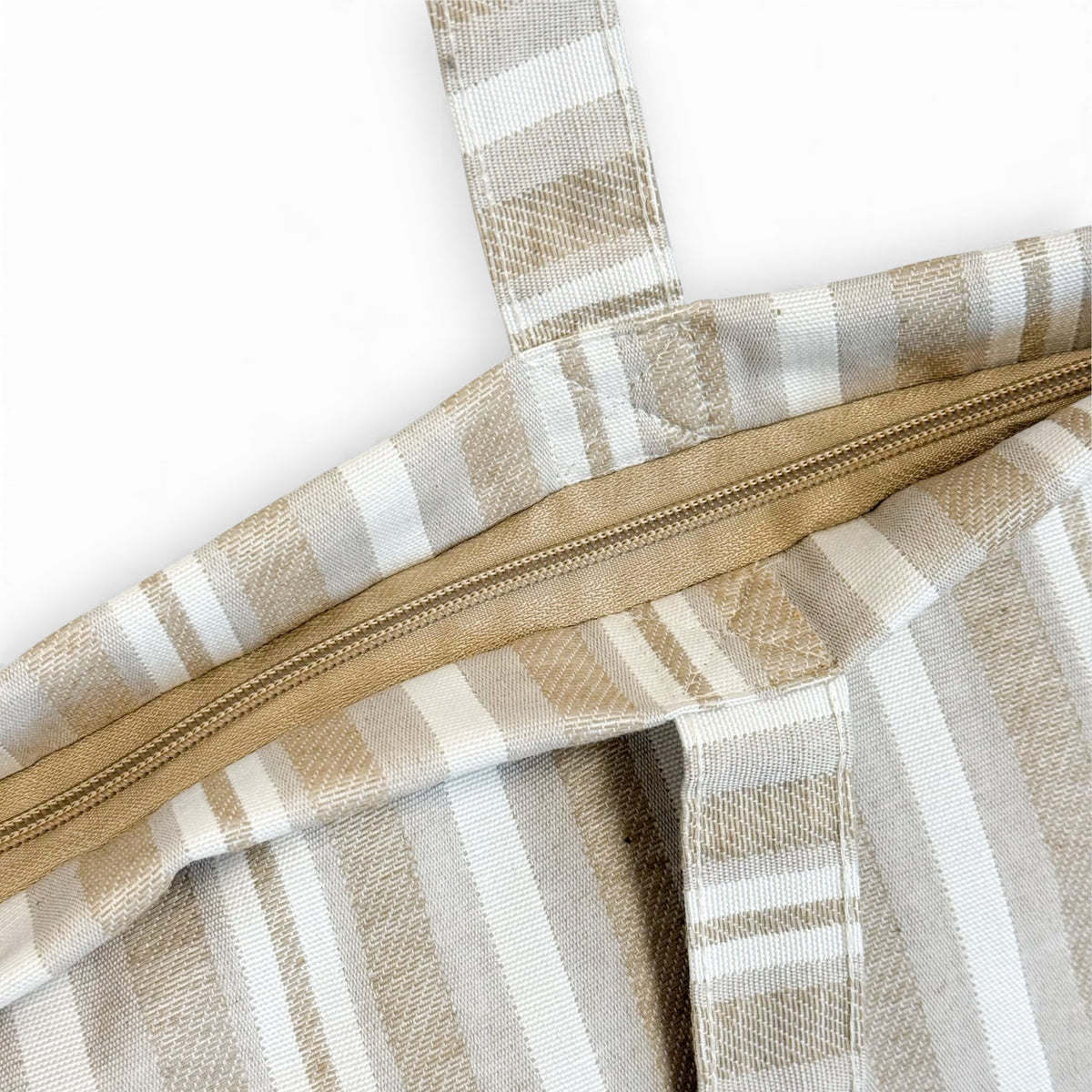 Open DE LA MUR beige jacquard tote showing the zip closure and interior
