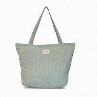 DE LA MUR Teo zippered tote bag in light green and green textured stripe, front view