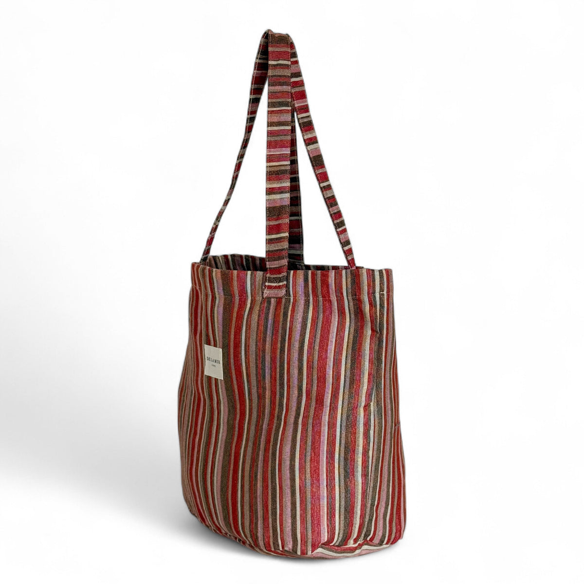 DE LA MUR pink and brown striped jacquard tote, three-quarter side view