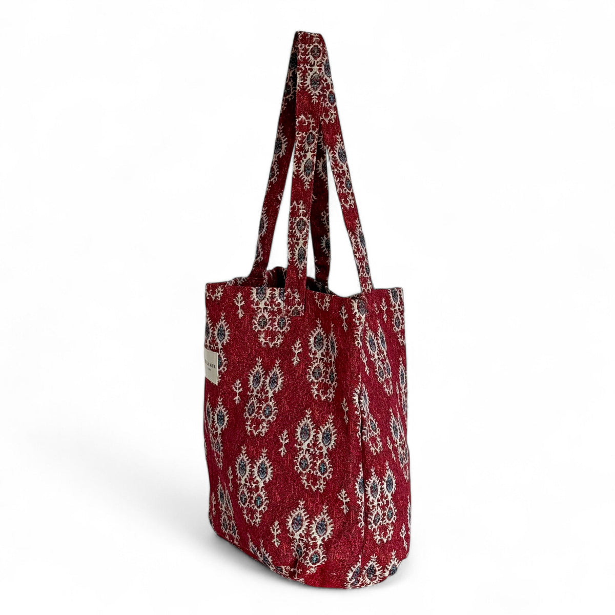 DE LA MUR red geometric jacquard tote bag, three-quarter side view