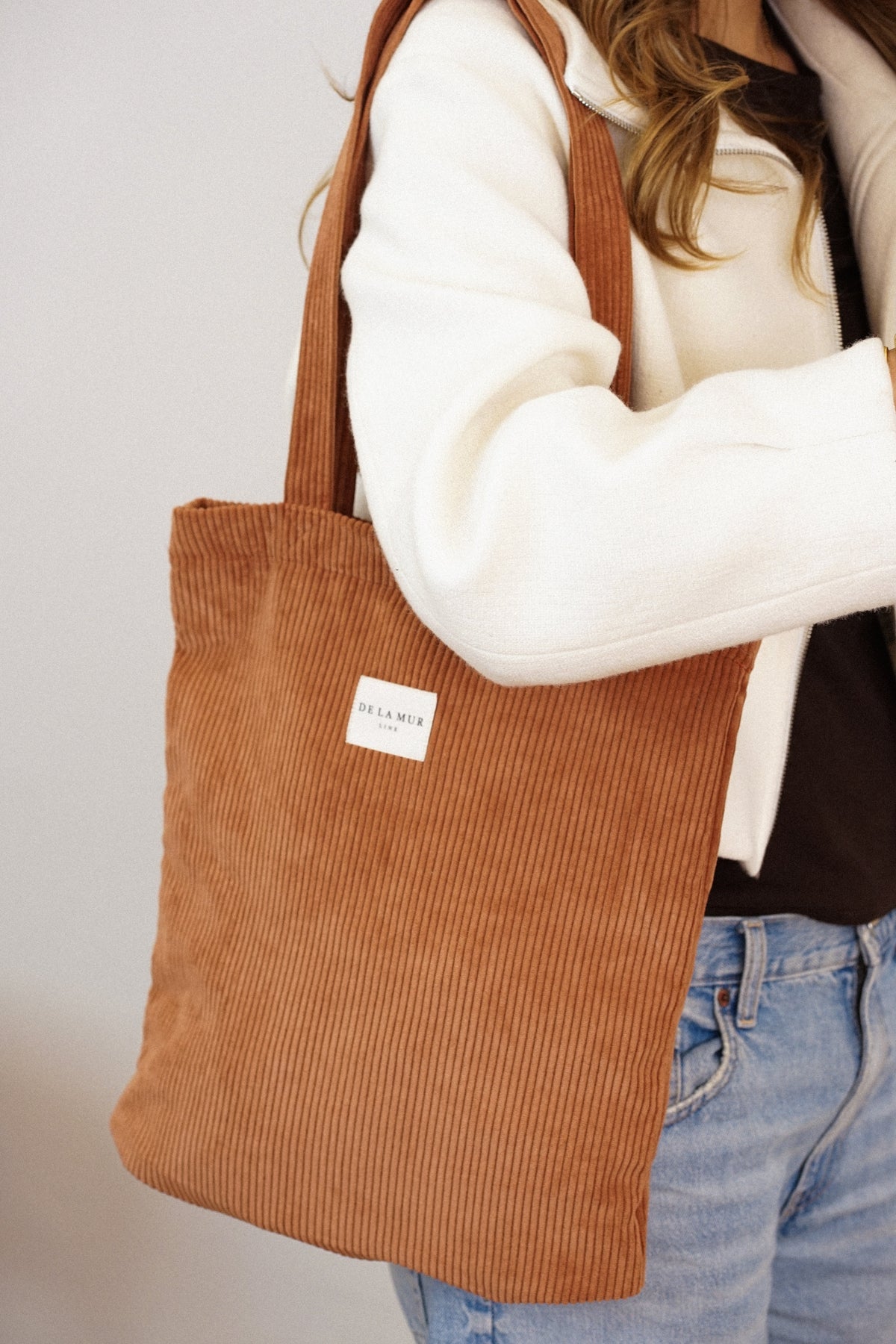 Terracotta DE LA MUR Corduroy Medium Zippered Bag worn over the shoulder