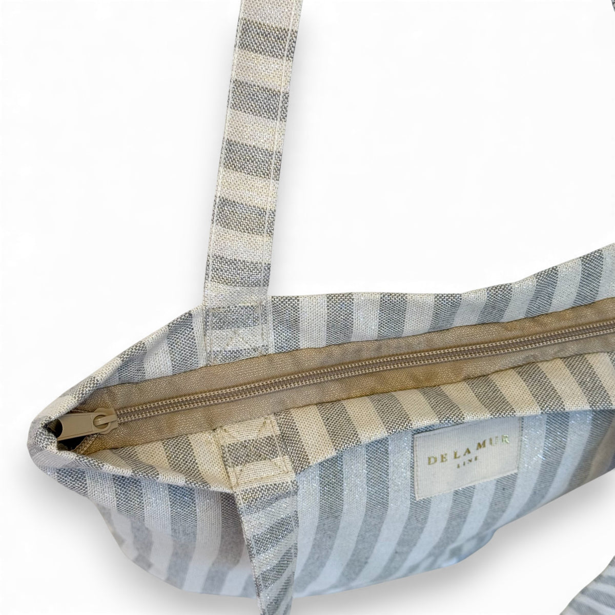 Open DE LA MUR Lugris bag showing zip closure and lined interior