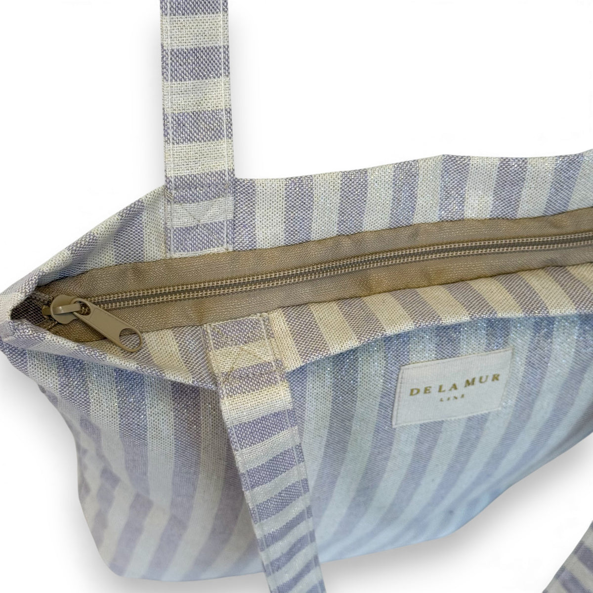 Open DE LA MUR Lulil bag showing zip closure and lined interior