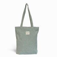 DE LA MUR Teo striped zippered tote bag in light green, front view