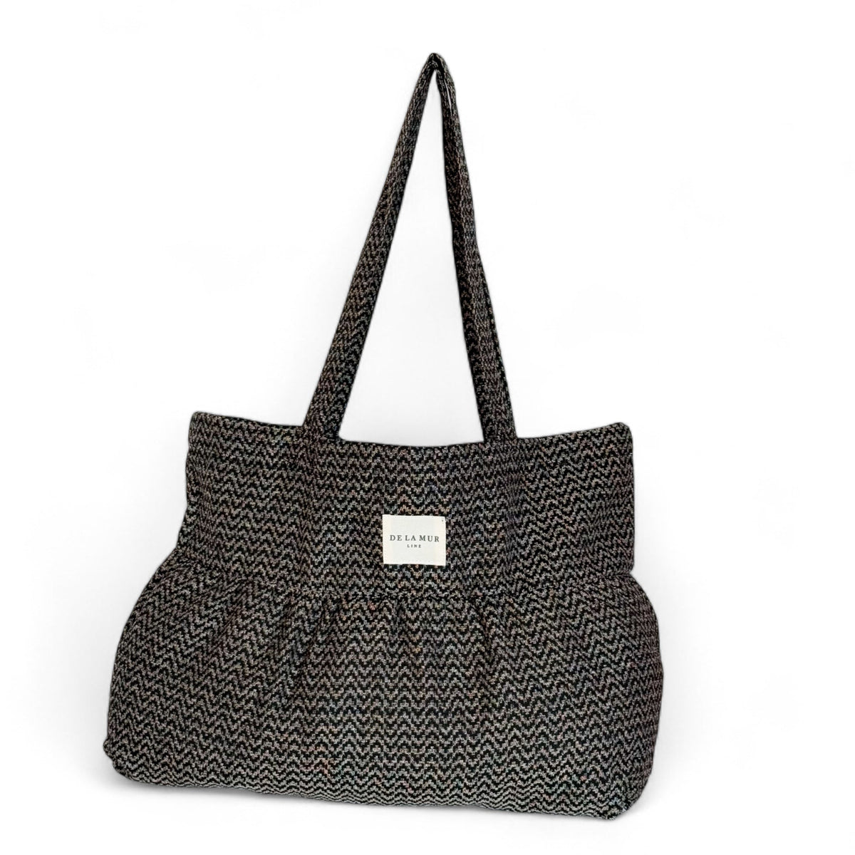 DE LA MUR zigzag jacquard ruffle tote bag in beige and black, front view