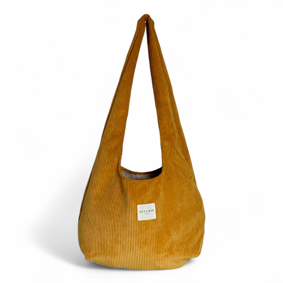 DE LA MUR Taz corduroy oval shoulder bag in mustard, front view