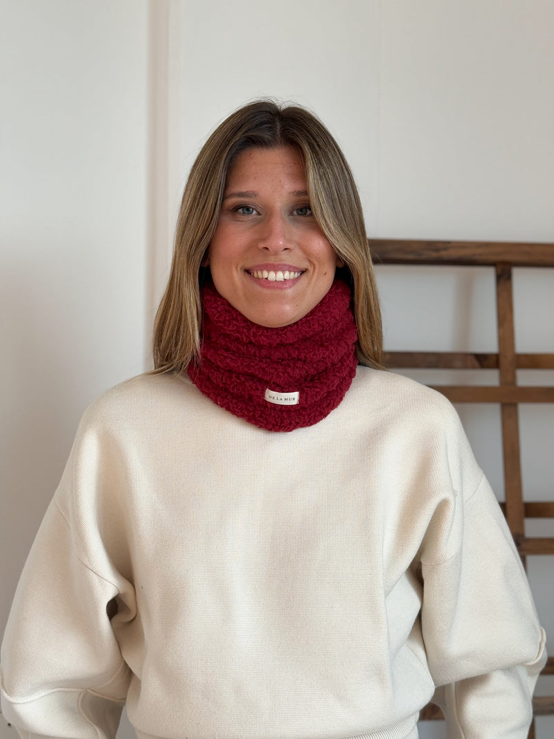 Model wearing the DE LA MUR burgundy Sherpa Neck Warmer, front view