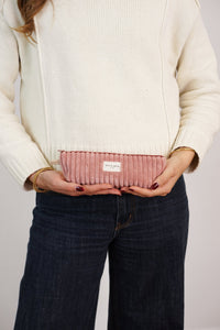Model holding the DE LA MUR dusty rose corduroy pencil case