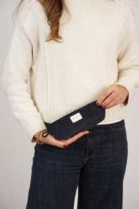 Model holding the DE LA MUR black corduroy pencil case