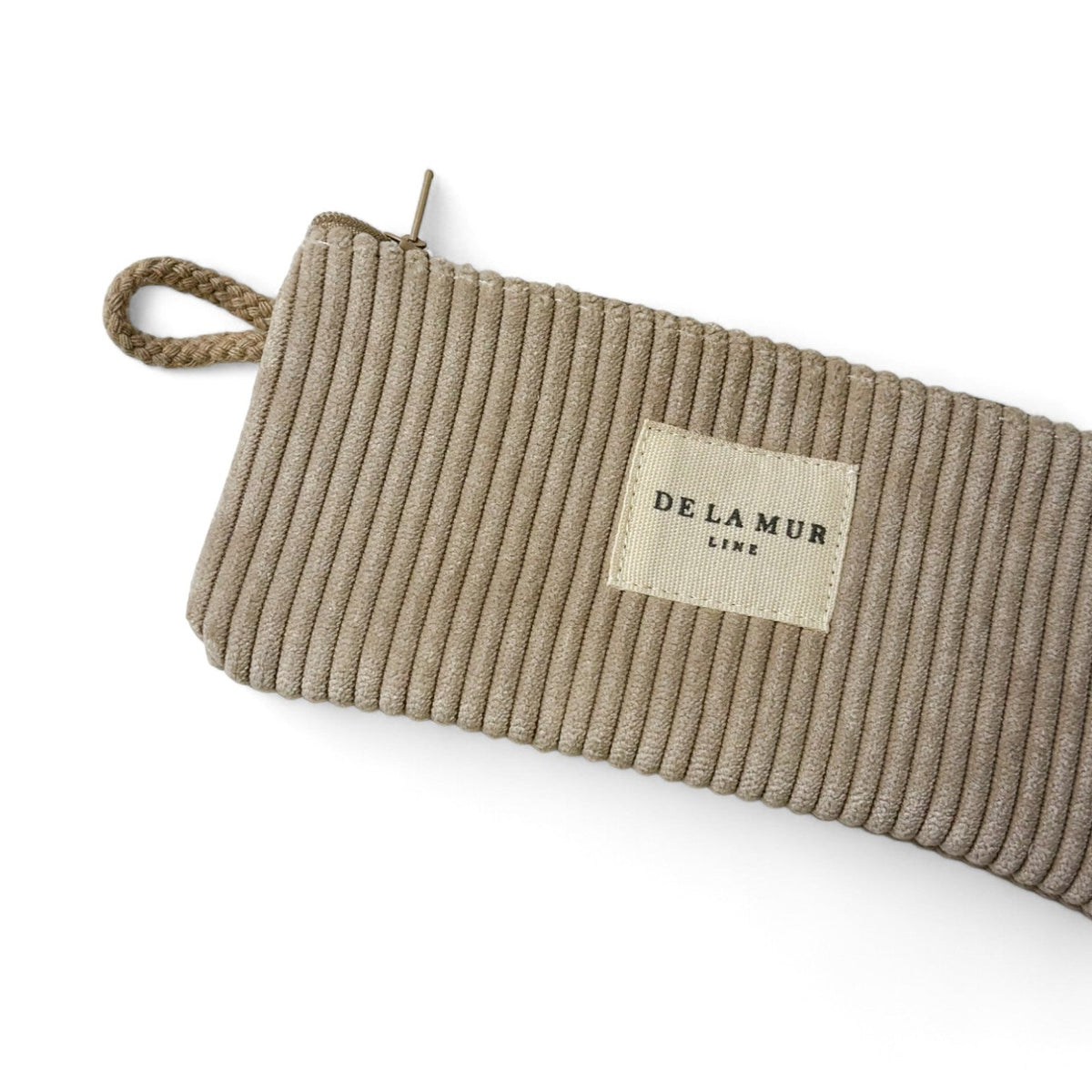 DE LA MUR eyewear case detail showing zip pull and braided wrist strap
