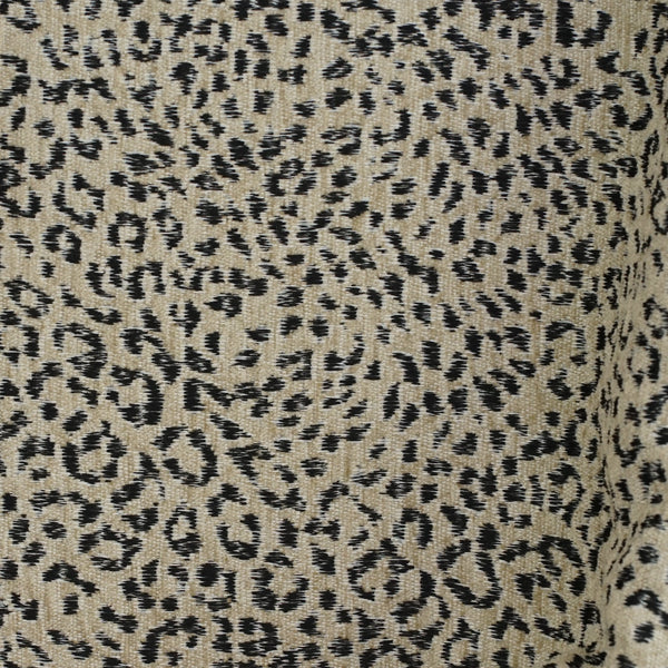 Close-up of the beige and black leopard jacquard weave of the DE LA MUR Koto coin purse