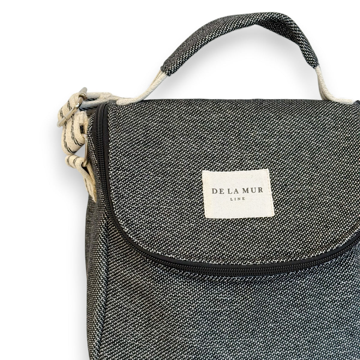 Close-up of the Sinay woven jacquard fabric and DE LA MUR Line label