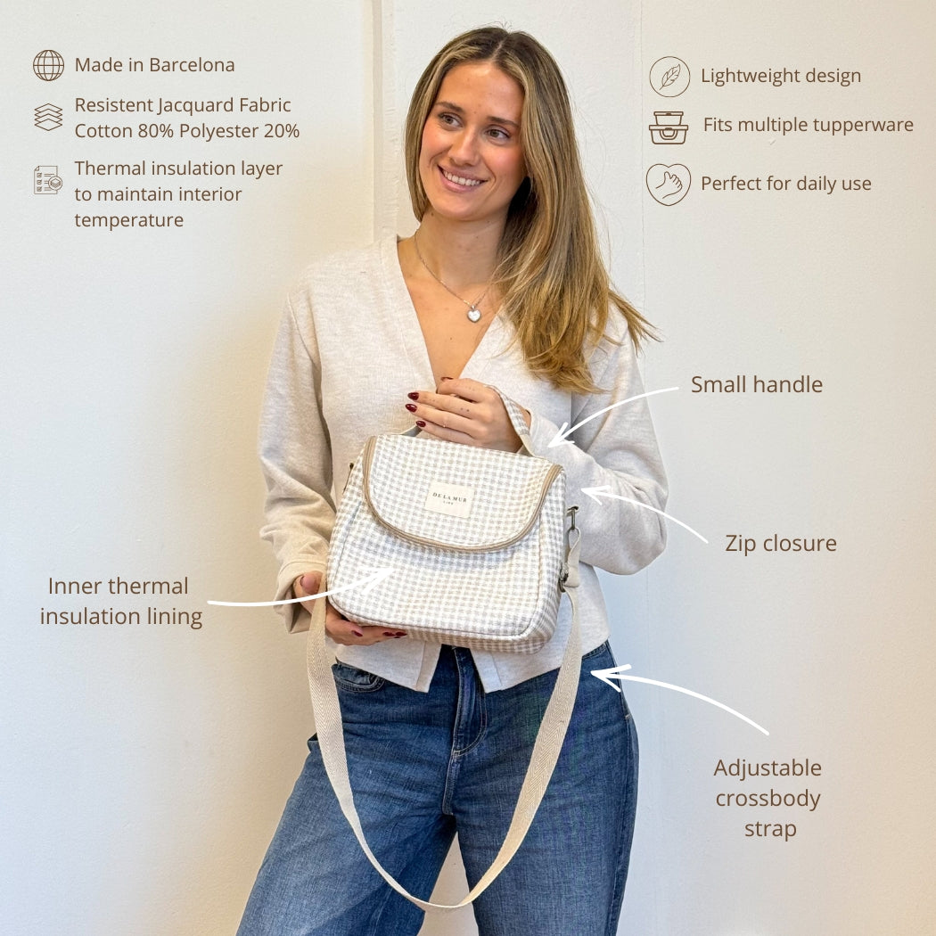 Model wearing the DE LA MUR Vison gingham insulated lunch bag with feature labels