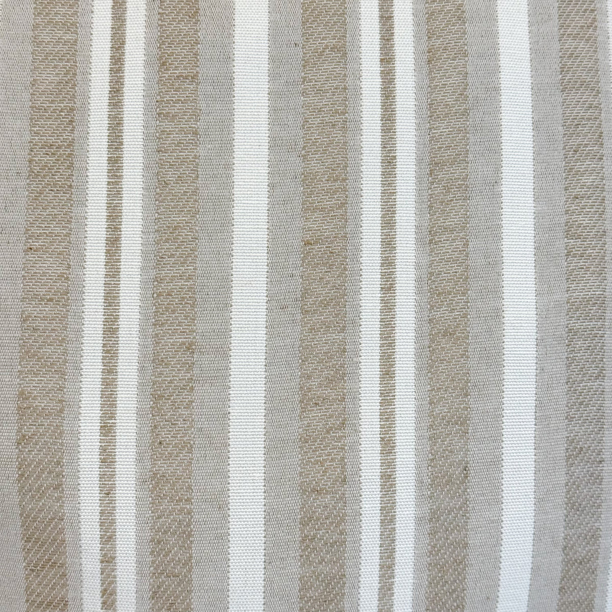 Close-up of the beige and off-white striped jacquard fabric of DE LA MUR Malik