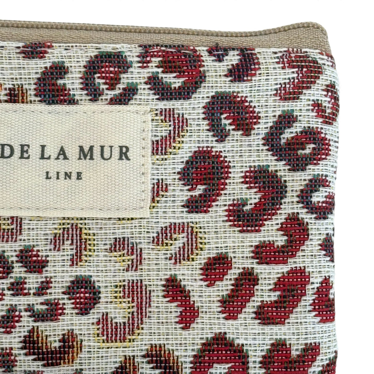 Close-up of DE LA MUR Line label on the Talco leopard print coin purse