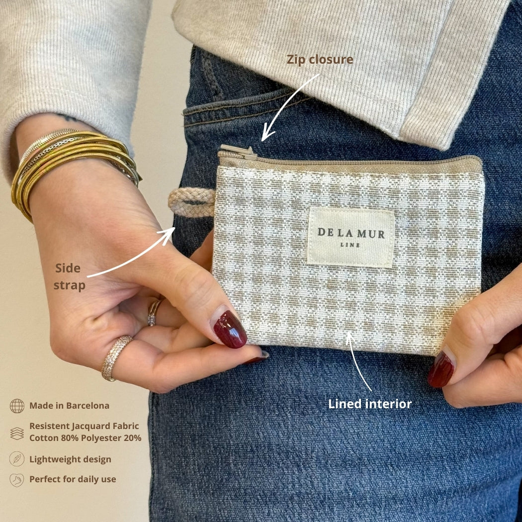 Model holding the open DE LA MUR Vison coin purse, with feature callouts and material info