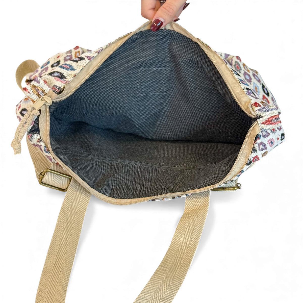Open DE LA MUR Urban backpack showing the lined gray interior