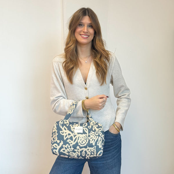 Model with the DE LA MUR Floral Jacquard Extra Large Makeup Bag – Navy & Cream (Akay)
