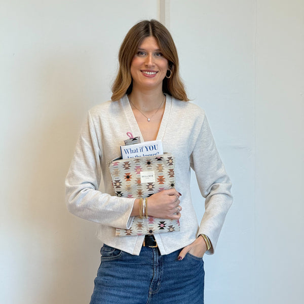 Model with the DE LA MUR Geometric Jacquard Book Cover With Matching Bookmark – Pink & Orange (Royal)