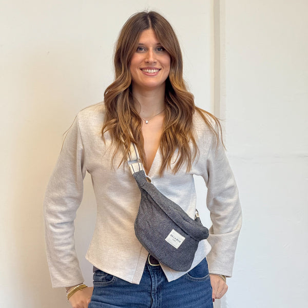 Model with the DE LA MUR Geometric Jacquard Fanny Pack – Navy & Cream (Sinay)