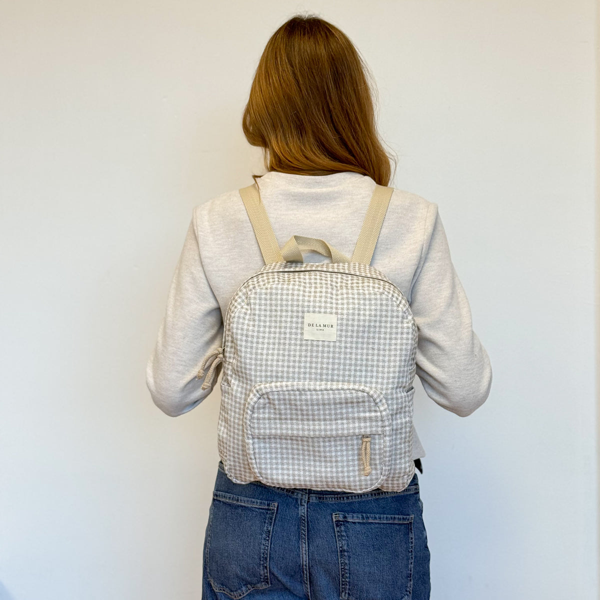 Model with the DE LA MUR Gingham Jacquard Backpack – Beige & Ecru (Vison)