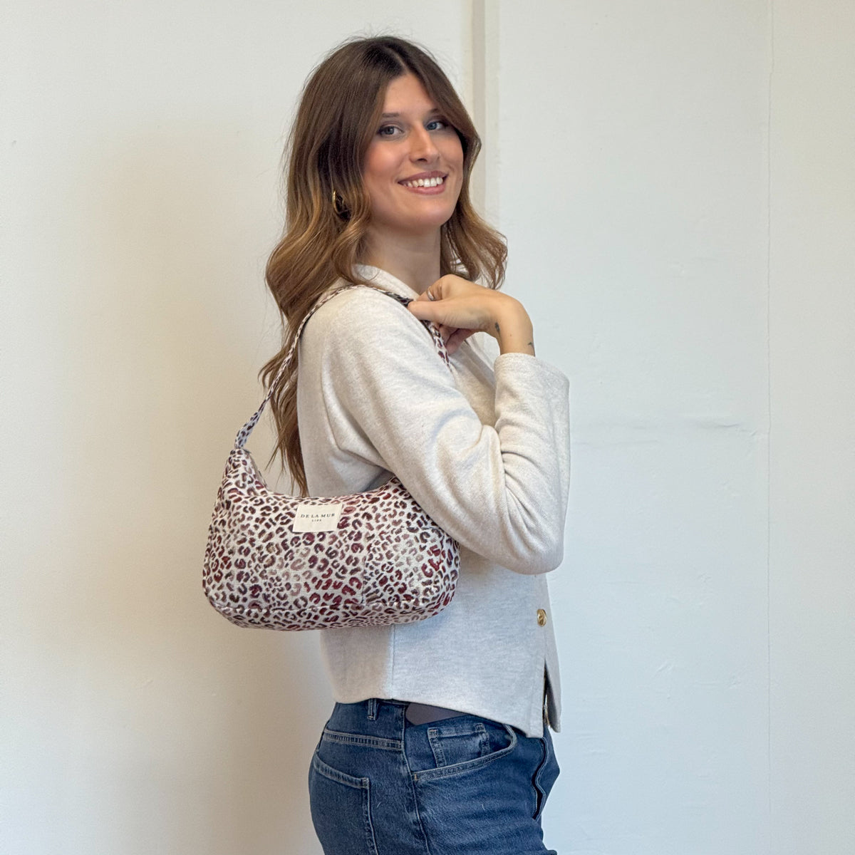 Model with the DE LA MUR Leopard Jacquard Shoulder Bag – Burgundy & Cream (Talco)