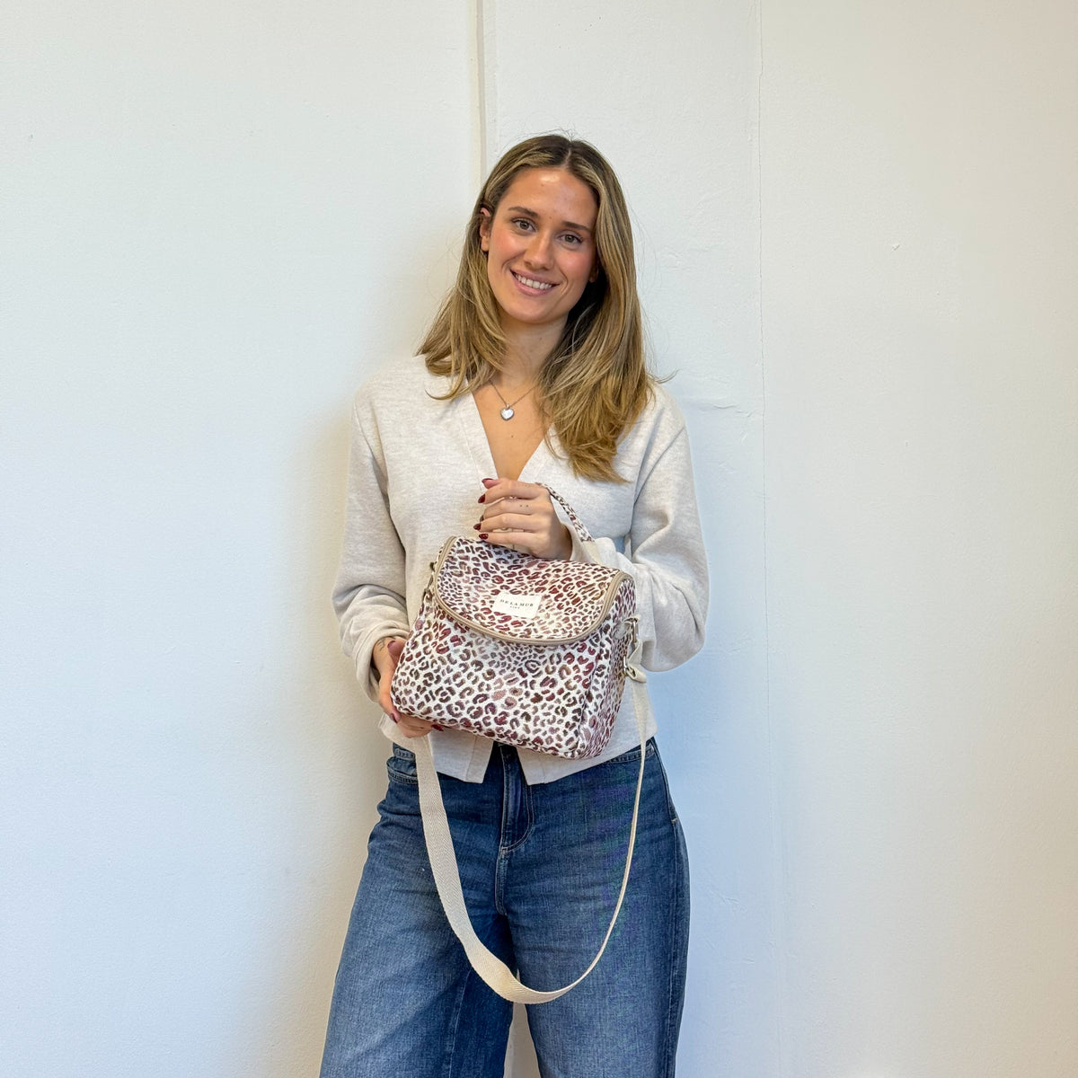 Model with the DE LA MUR Leopard Jacquard Lunch Bag – Burgundy & Cream (Talco)