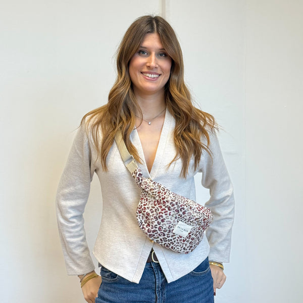 Model with the DE LA MUR Leopard Jacquard Fanny Pack – Burgundy & Cream (Talco)