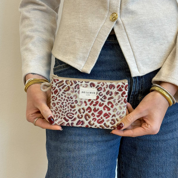 Model with the DE LA MUR Leopard Jacquard Small Makeup Bag / Coin Purse – Burgundy & Cream (Talco)