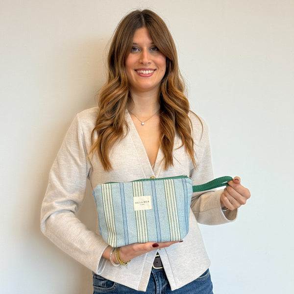 Model with the DE LA MUR Striped Jacquard Large Makeup Bag – Blue & Green (Cata)