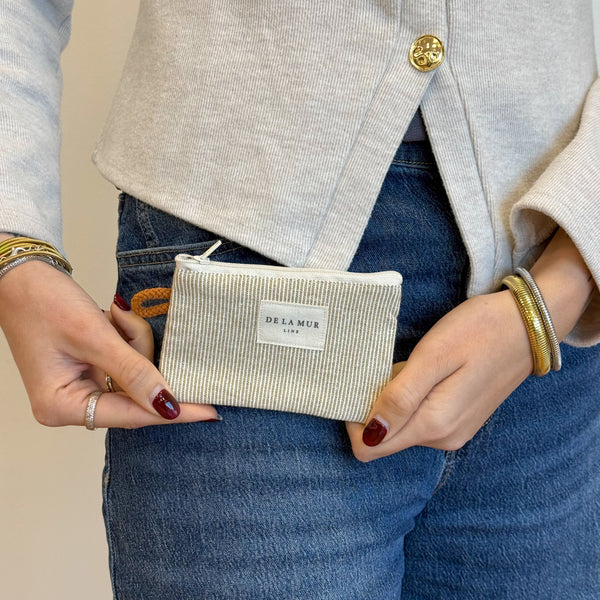 Model with the DE LA MUR Striped Jacquard Coin Purse – Olive & Cream (Foz)