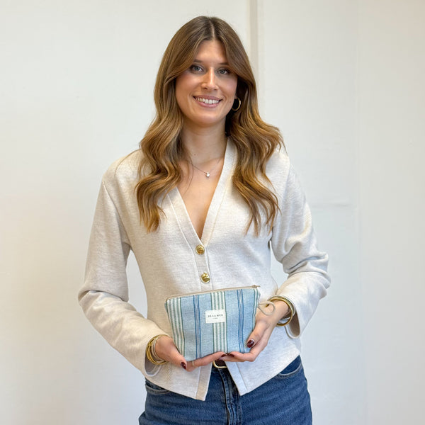 Model with the DE LA MUR Striped Jacquard Small Makeup Bag – Blue & Green (Cata)
