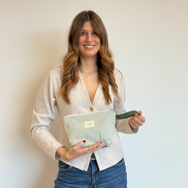 Model with the DE LA MUR Striped Large Makeup Bag – Light Green & Green (Teo)