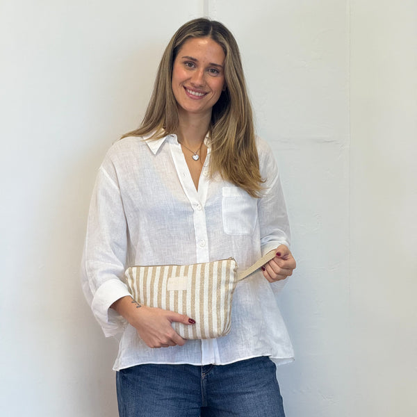 Model with the DE LA MUR Striped Large Makeup Bag – Beige & Gold (Lumos)