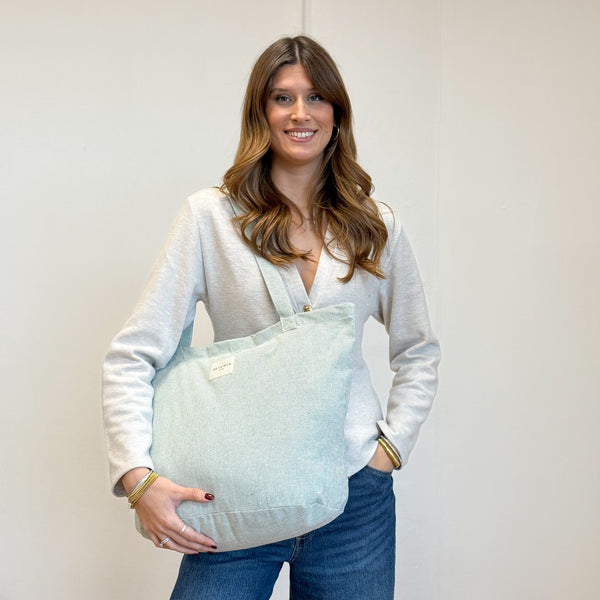 Model with the DE LA MUR Striped Large Zippered Tote Bag – Light Green & Green (Teo)